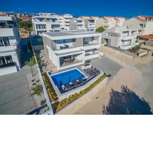 Apartments with a swimming pool Novalja, Pag - 17216