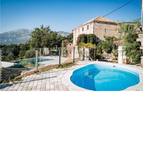 Awesome apartment in Gruda with Outdoor swimming pool, WiFi and 2 Bedrooms