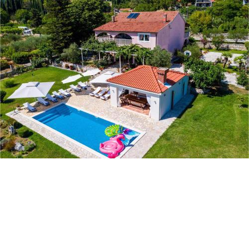 Awesome home in Gruda with Outdoor swimming pool, Jacuzzi and 4 Bedrooms