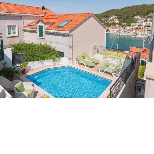 Awesome home in Pucisca with Outdoor swimming pool, WiFi and Heated swimming pool