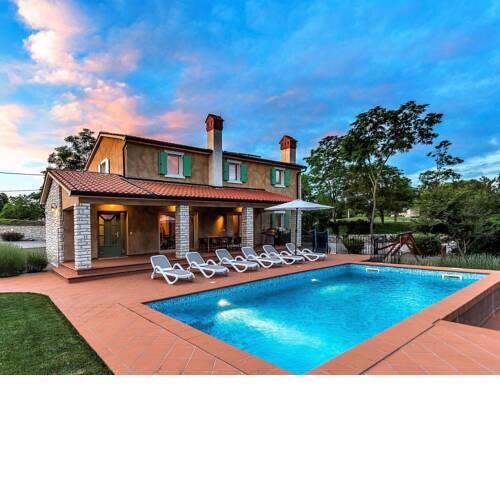 Beautiful villa with swimming pool surrounded by a natural fence