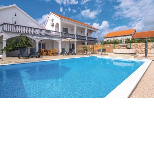 Five-Bedroom Holiday Home in Tinj