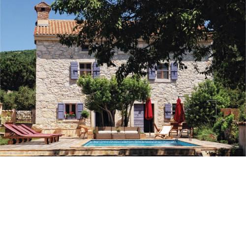 Four-Bedroom Holiday home Koromacno with a Fireplace 09