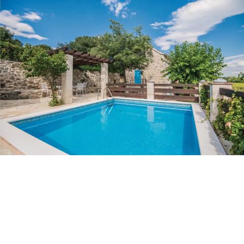 Four-Bedroom Holiday home Zmijavci with a Fireplace 09