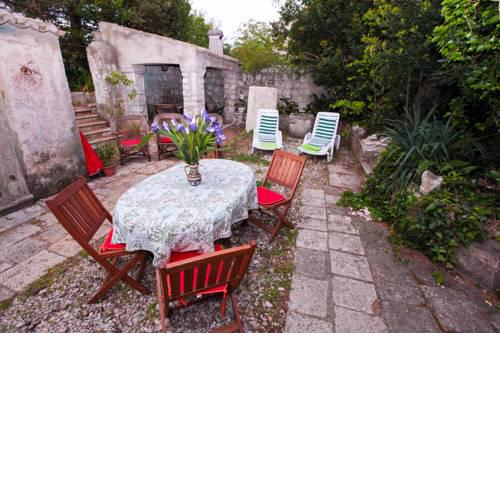 House And Garden By The Sea