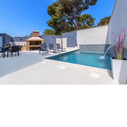 Luxury apartment with private backyard and heated pool