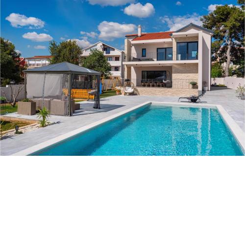 Nice home in Biograd na Moru with Outdoor swimming pool, WiFi and 5 Bedrooms