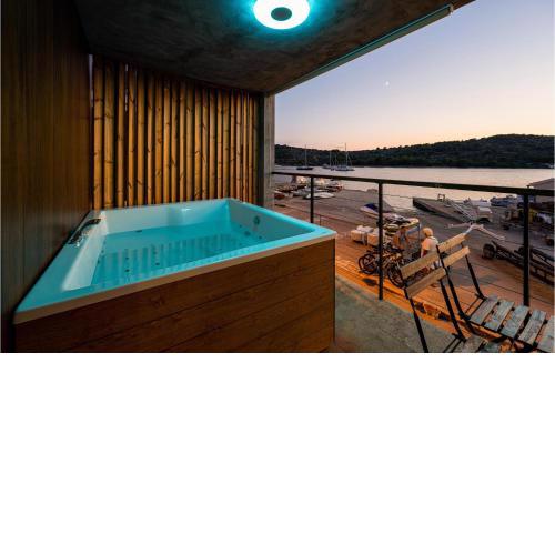Nice home in Kaprije with Jacuzzi, WiFi and 4 Bedrooms