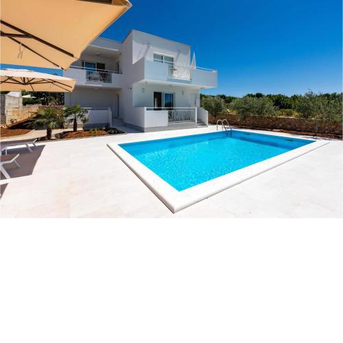 Nice home in Punat with Outdoor swimming pool, WiFi and 4 Bedrooms