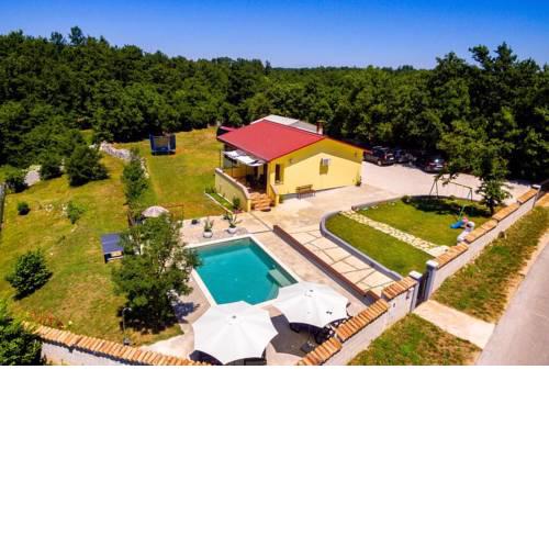 Sunny yellow house with a pool