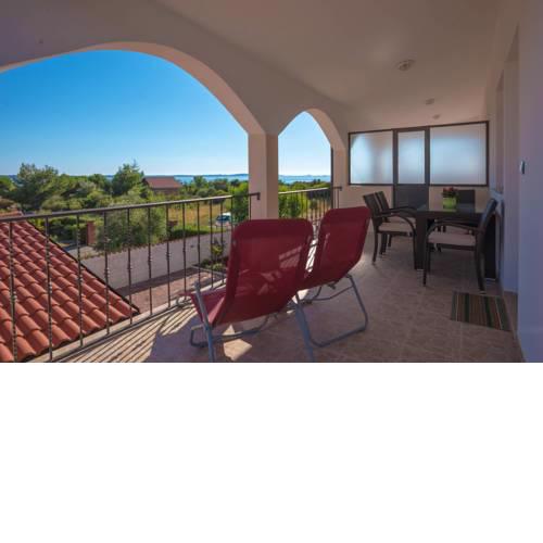 Teuta Apartments - a beach and a sea view