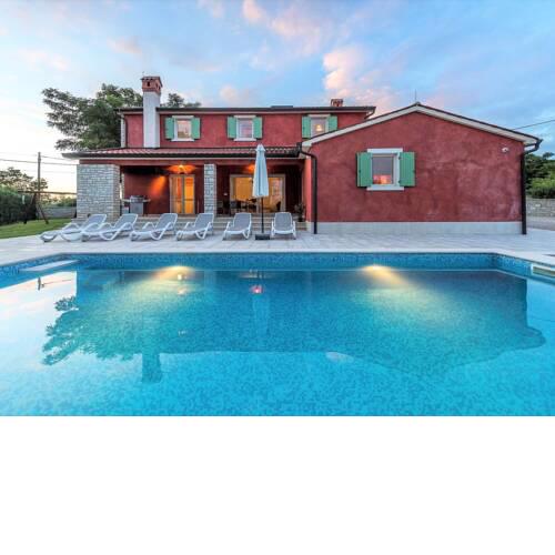 The villa surrounded by a beautiful garden with swimming pool