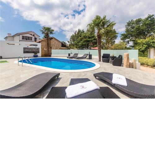 Two-Bedroom Apartment Krk with a Fireplace 02