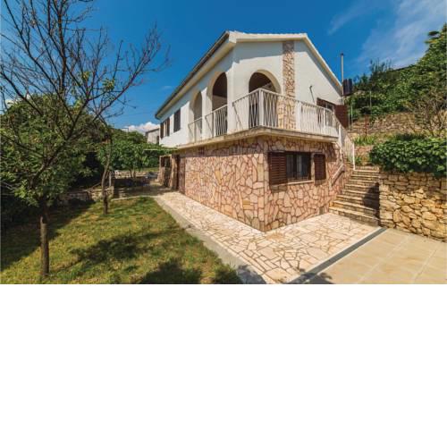 Two-Bedroom Holiday Home in Okrug Gornji