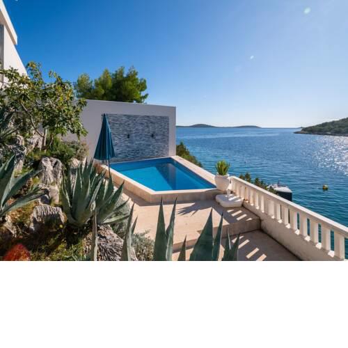 Villa Sine with private pool and a sea view, located 50 m from the beach in Vinišće