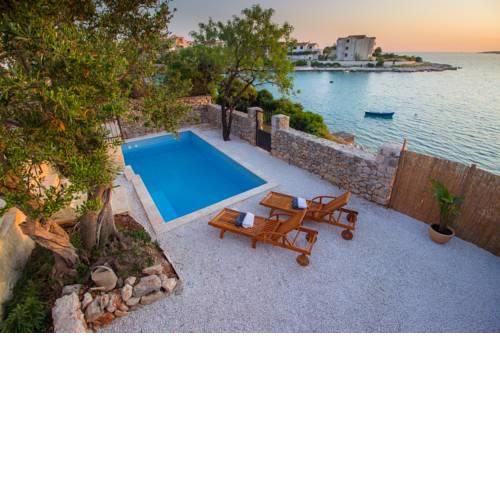 Villa with Pool First Row to the Sea and in Front of the Beach